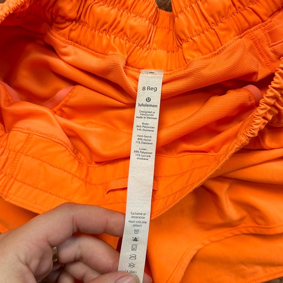 SOLD LULULEMON BRIGHT HIGHLIGHT ORANGE HOTTY HOT SHORTS - Picture 3 of 7